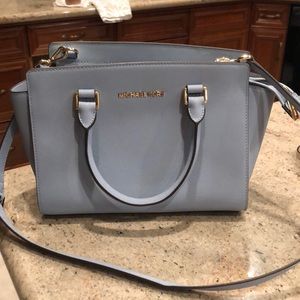A light blue purse from Michael Kors.
